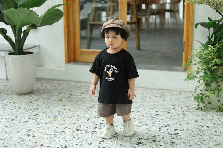 Girl In Hat And T-shirt