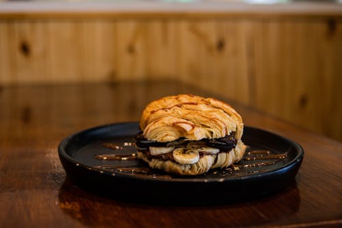 Croissant with Banana Slices on Plate