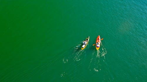 People Kayaking on Lake