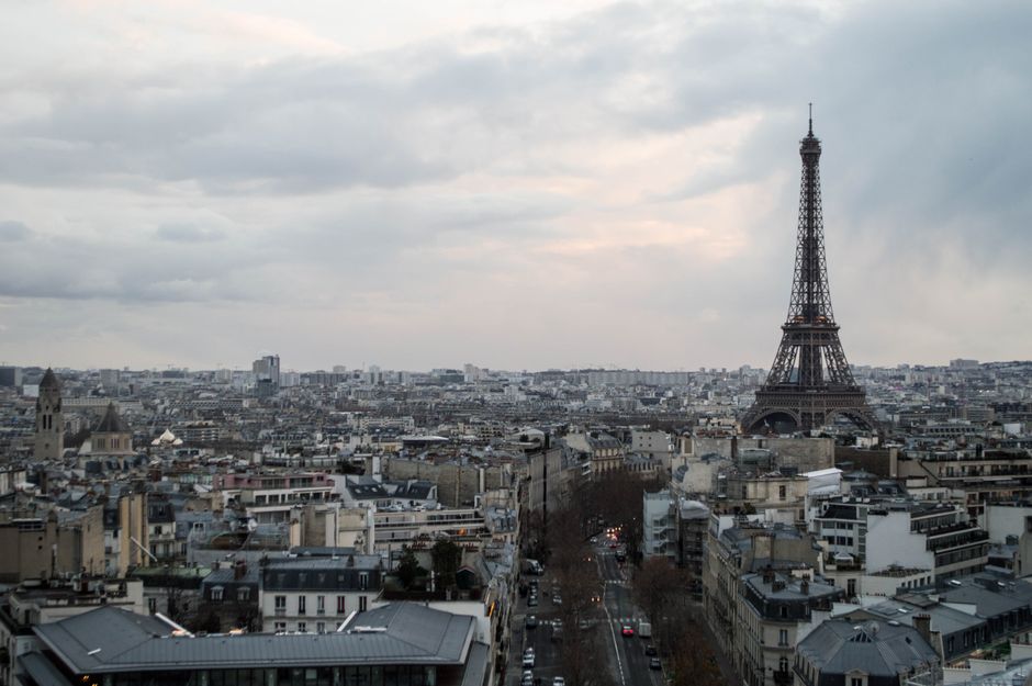 A luxurious hotel room in Paris with a stunning view of the Eiffel Tower