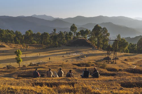 Farmers Sitting on Field