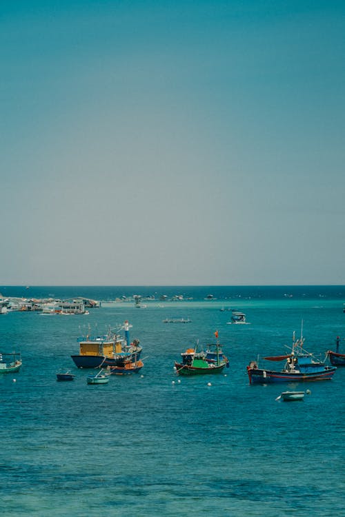 Boats and Motorboats on Sea Shore