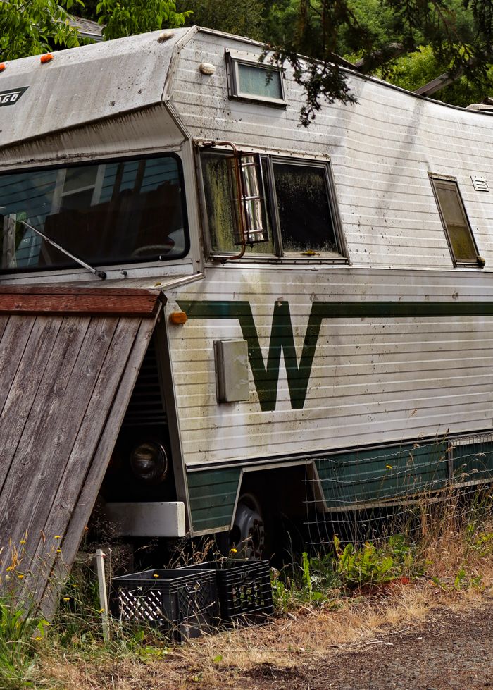 Camper trailer parked on an open field