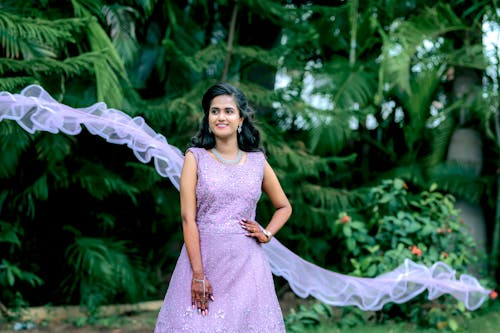 Woman Wearing Purple Dress in a Park