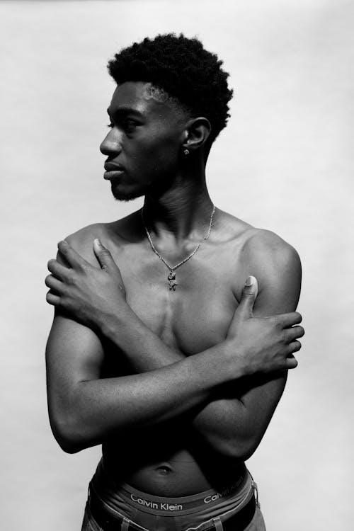 Portrait of Topless Man Standing with Arms Crossed