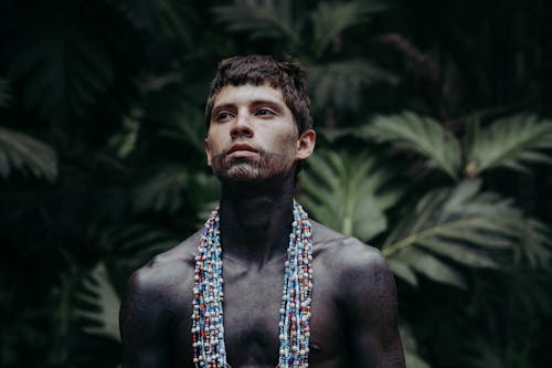 Man with Necklaces and Tribal Tattoos