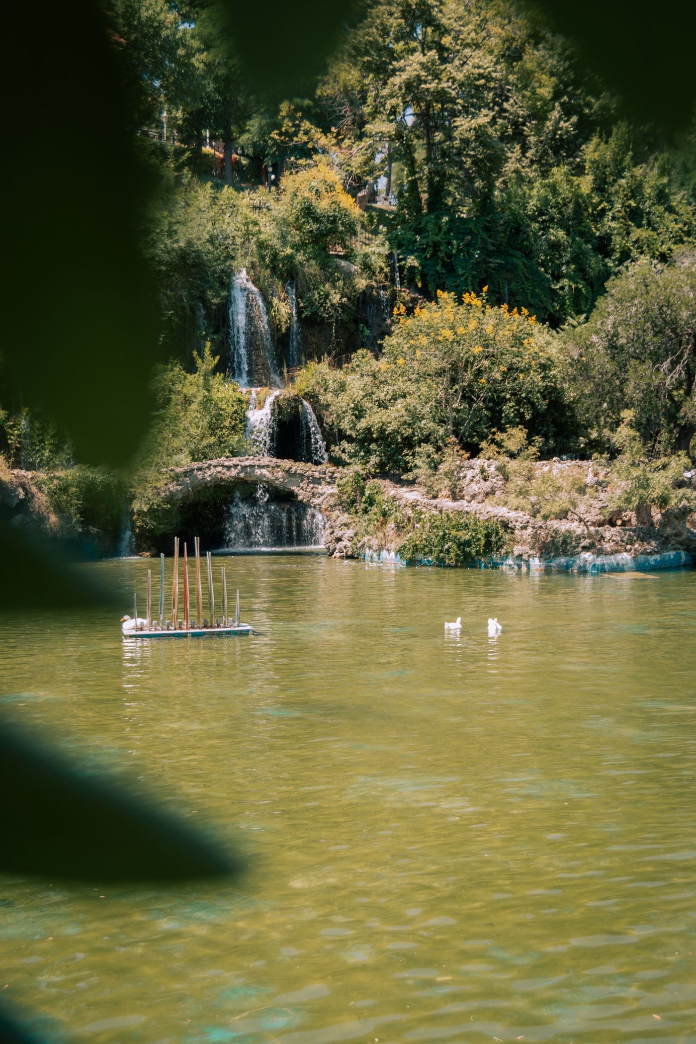 Waterfall flowing into a landscaped pond