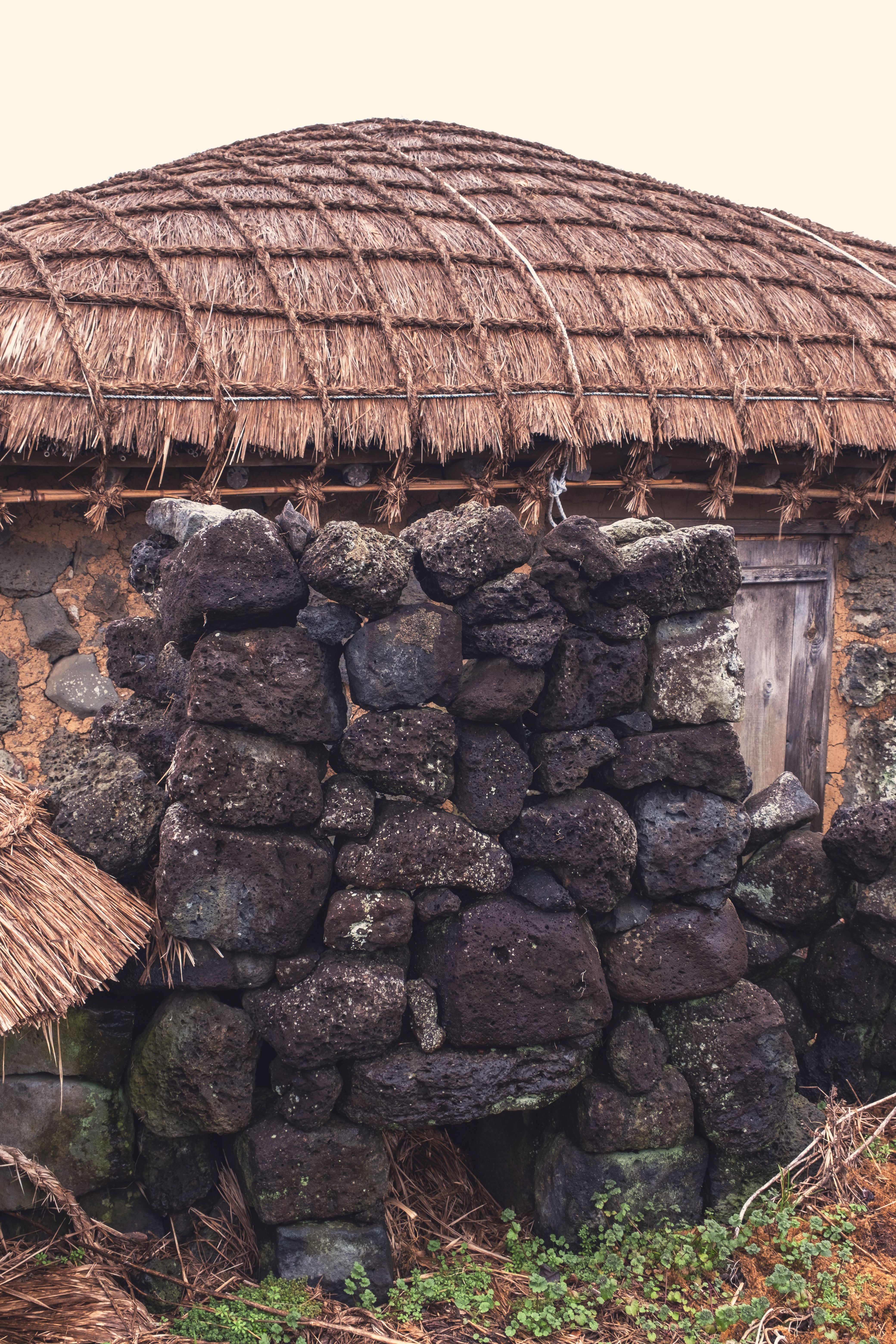 Stone Wall in front of a Village House with a Thatched Roof · Free ... - Stones Used For Mountain Village Wall Construction
