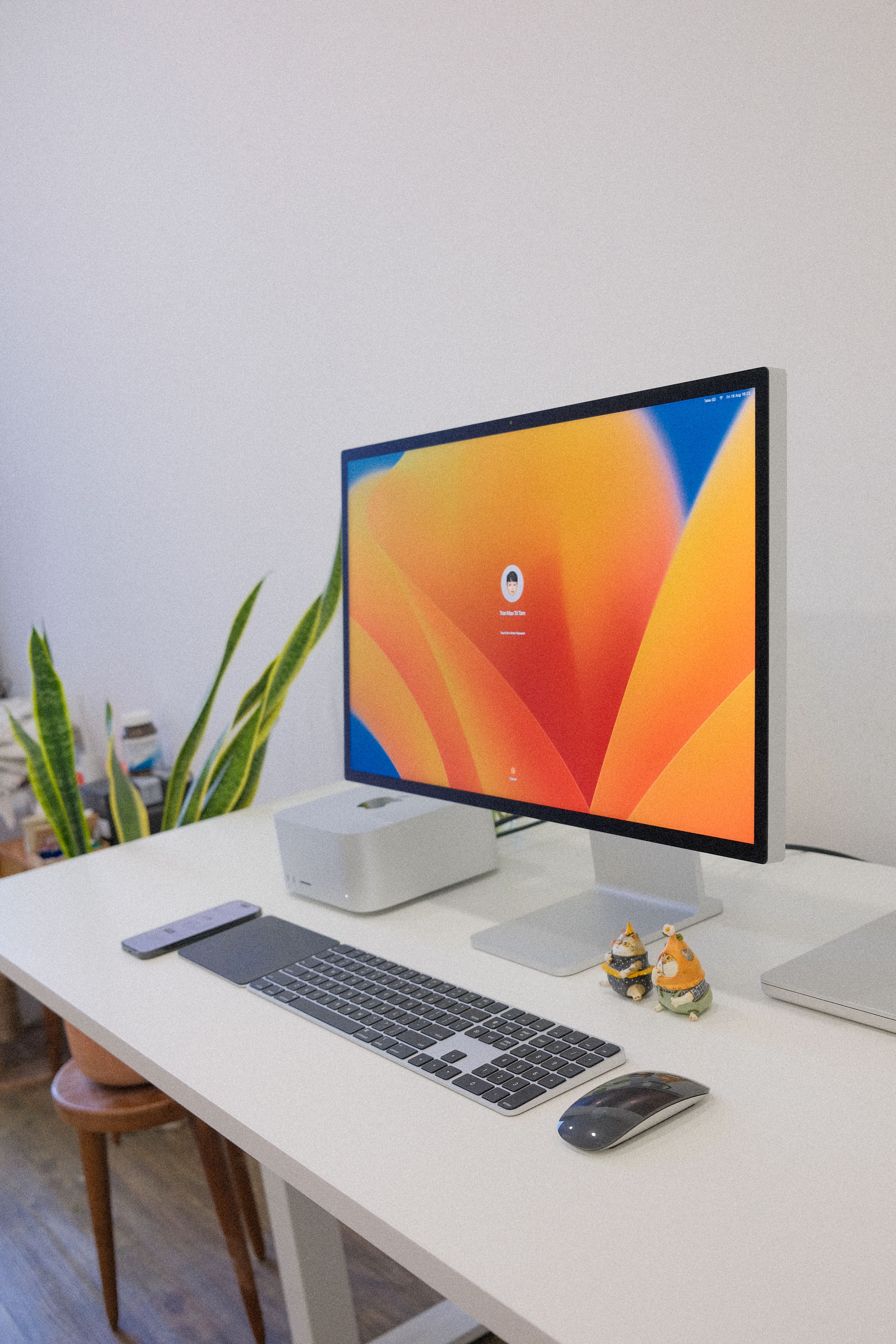 Contemporary office setup featuring a desktop computer with an orange wallpaper on a white desk.. pexels, contemporary, offic