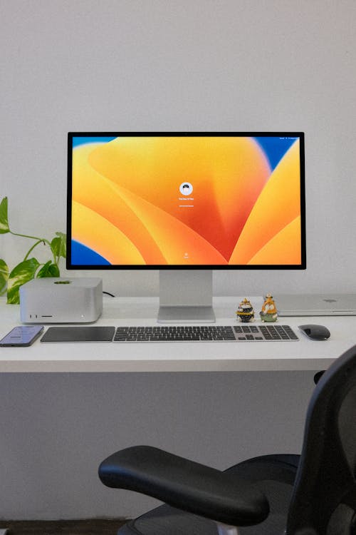 Mac Studio Computer and a Large Display on a White Desk · Free Stock Photo