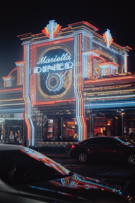 Vibrant neon lights illuminate the Marietta Diner in Georgia, showcasing its retro charm.