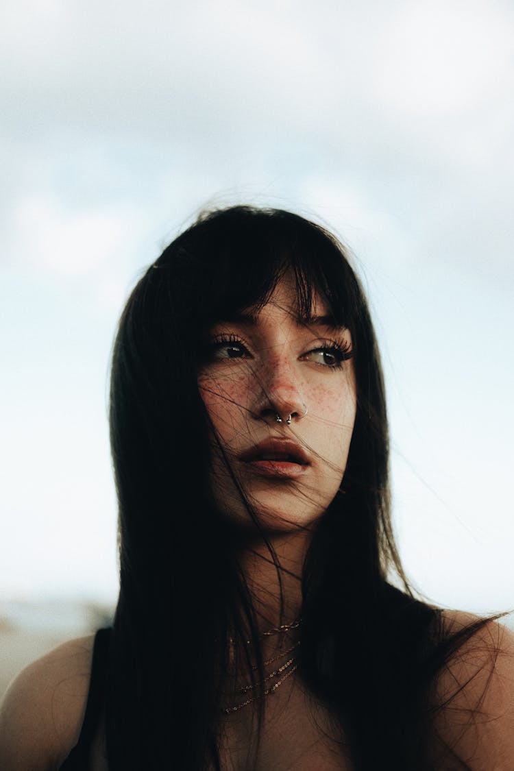 Portrait Of A Young Woman With Dark Hair And Bangs 