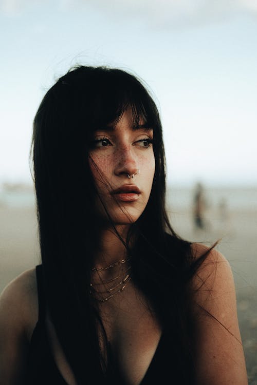 Portrait of a Young Woman with Dark Hair and Bangs 