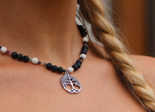 Close-up of Necklace with Stones on Woman Neck