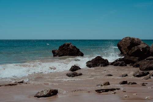 Photos gratuites de cailloux, côte, faire signe