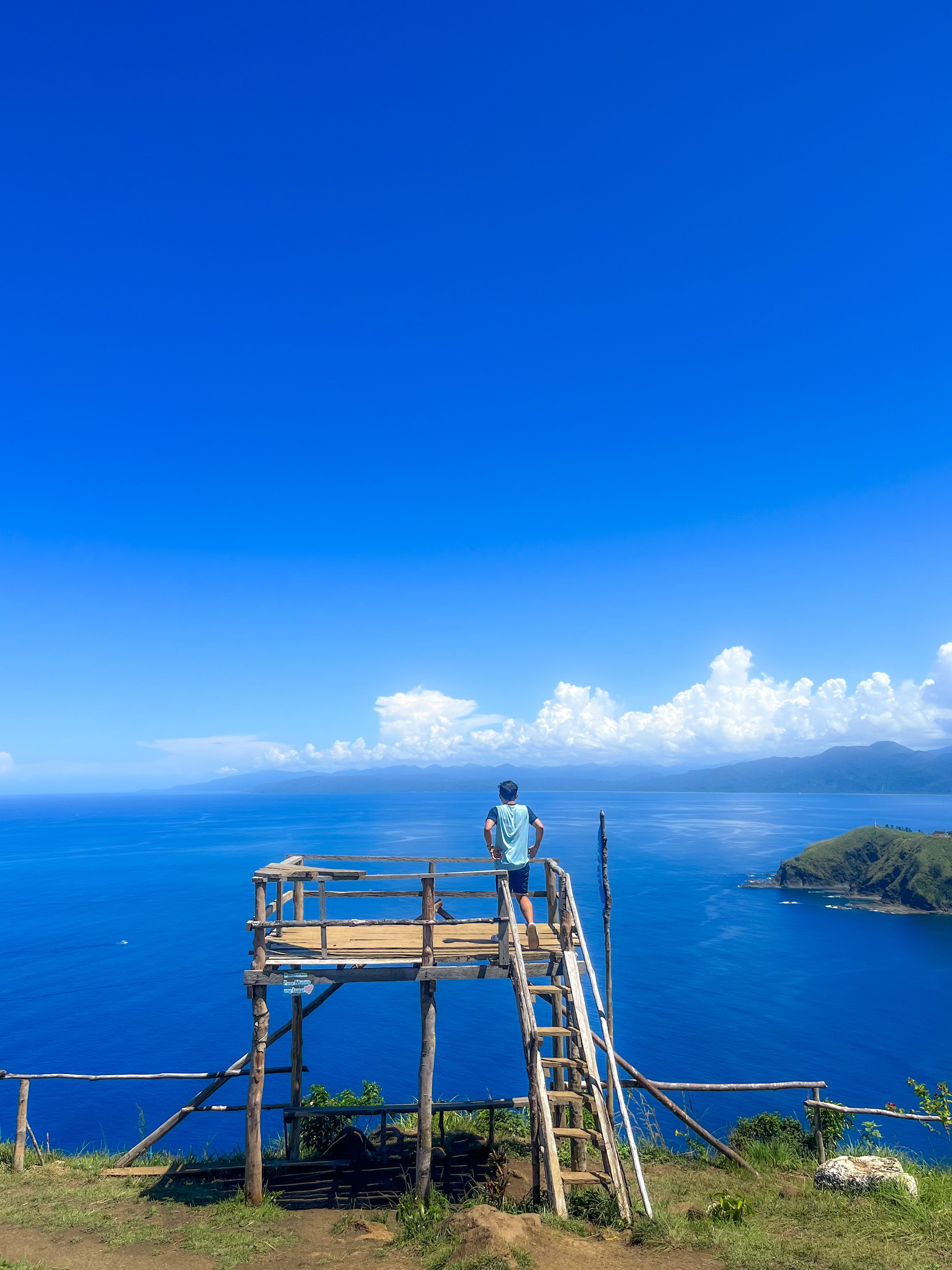 Man on Wooden Platform on Sea Coast · Free Stock Photo