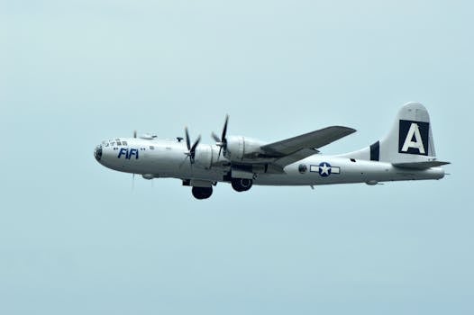 Historic B-29 Superfortress bomber flying mid-air with visible propellers.