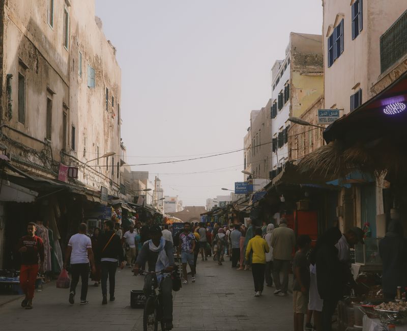 Vibrant market scene in Morocco showcasing local culture and visitors