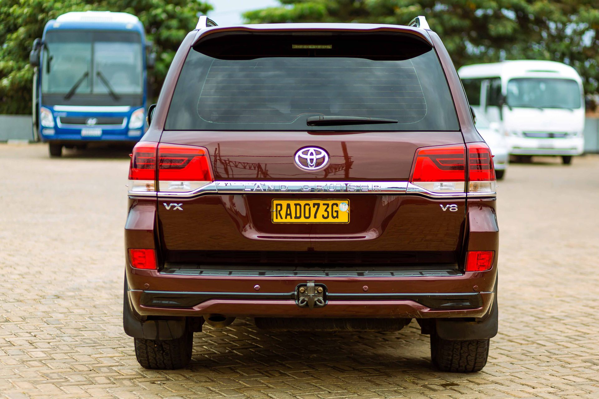 A Toyota Land Cruiser V8 parked in an outdoor parking lot on a clear day.