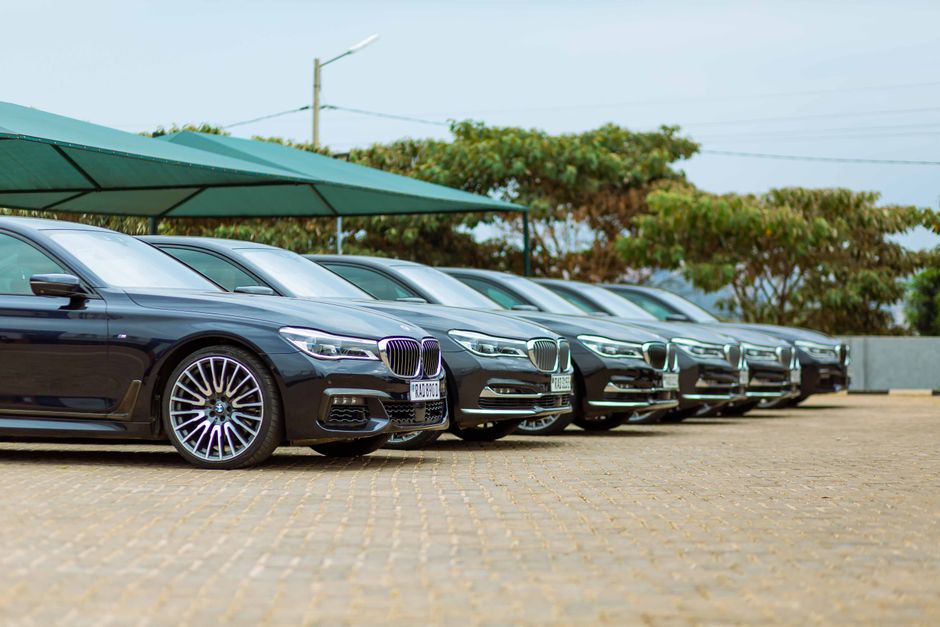 A diverse fleet of luxury sedans and SUVs parked in a row - car service to airport near me A diverse fleet of luxury sedans and SUVs parked in a row - car service to airport near me