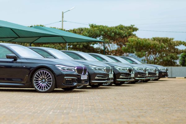 Row of new cars at a dealership showroom