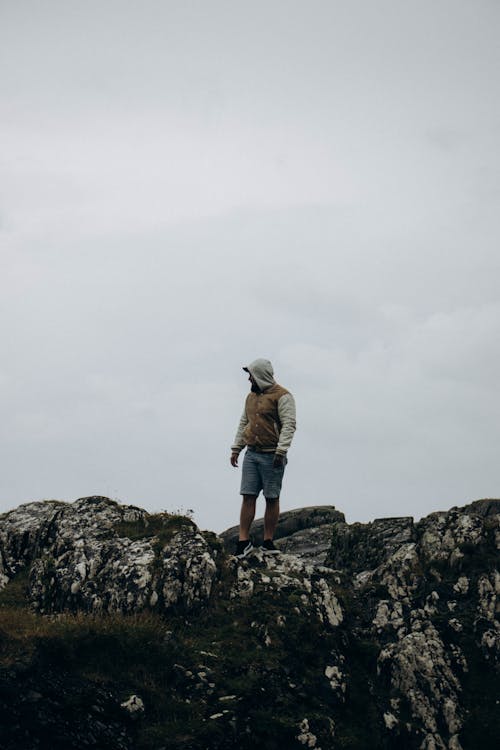 Man Standing on Rocks 