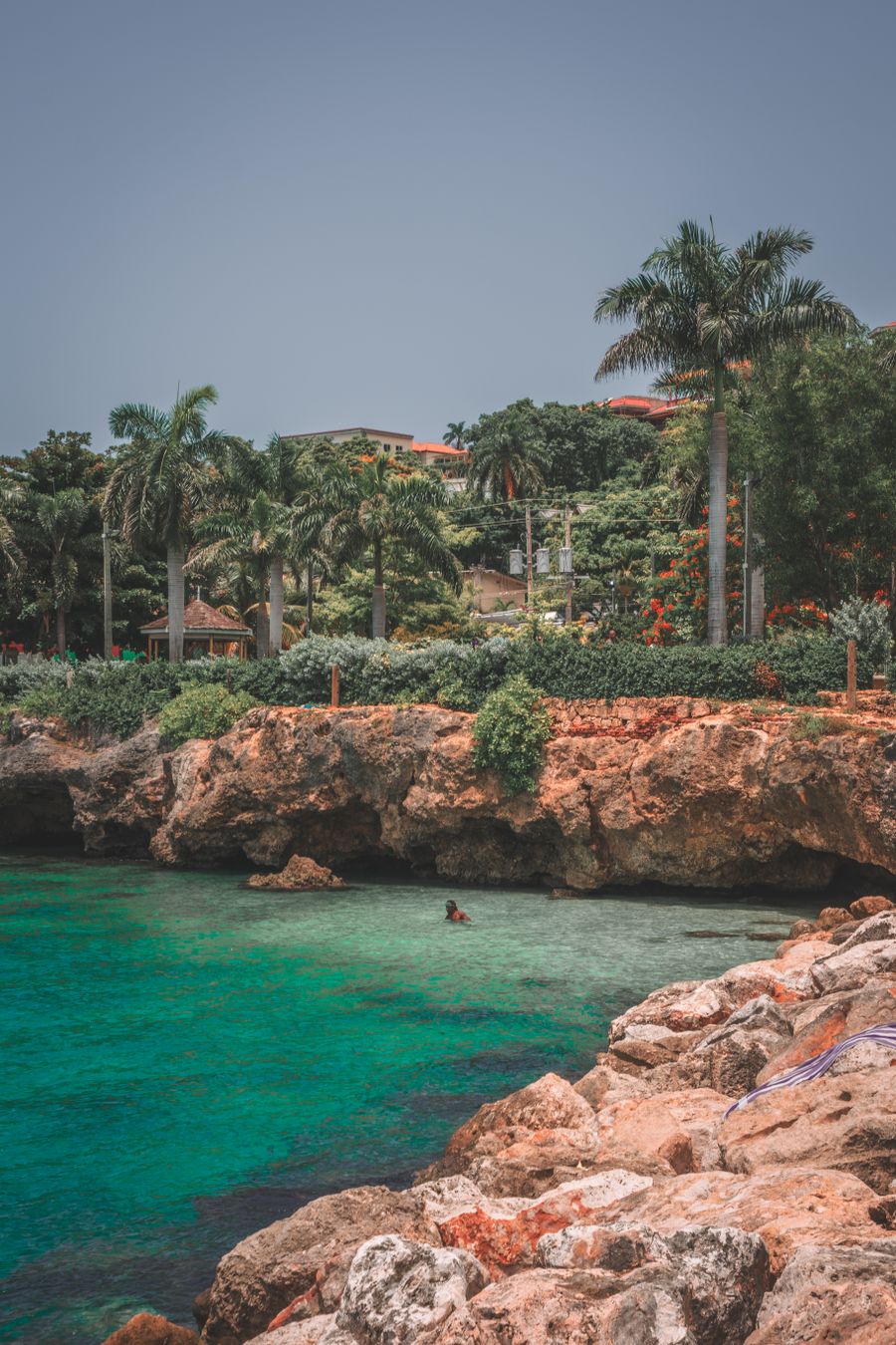 Palm trees over turquoise water in Montego Bay, Jamaica