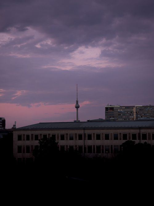 Free Dramatic dawn view of the Berlin TV Tower silhouetted against a purple sky. Stock Photo