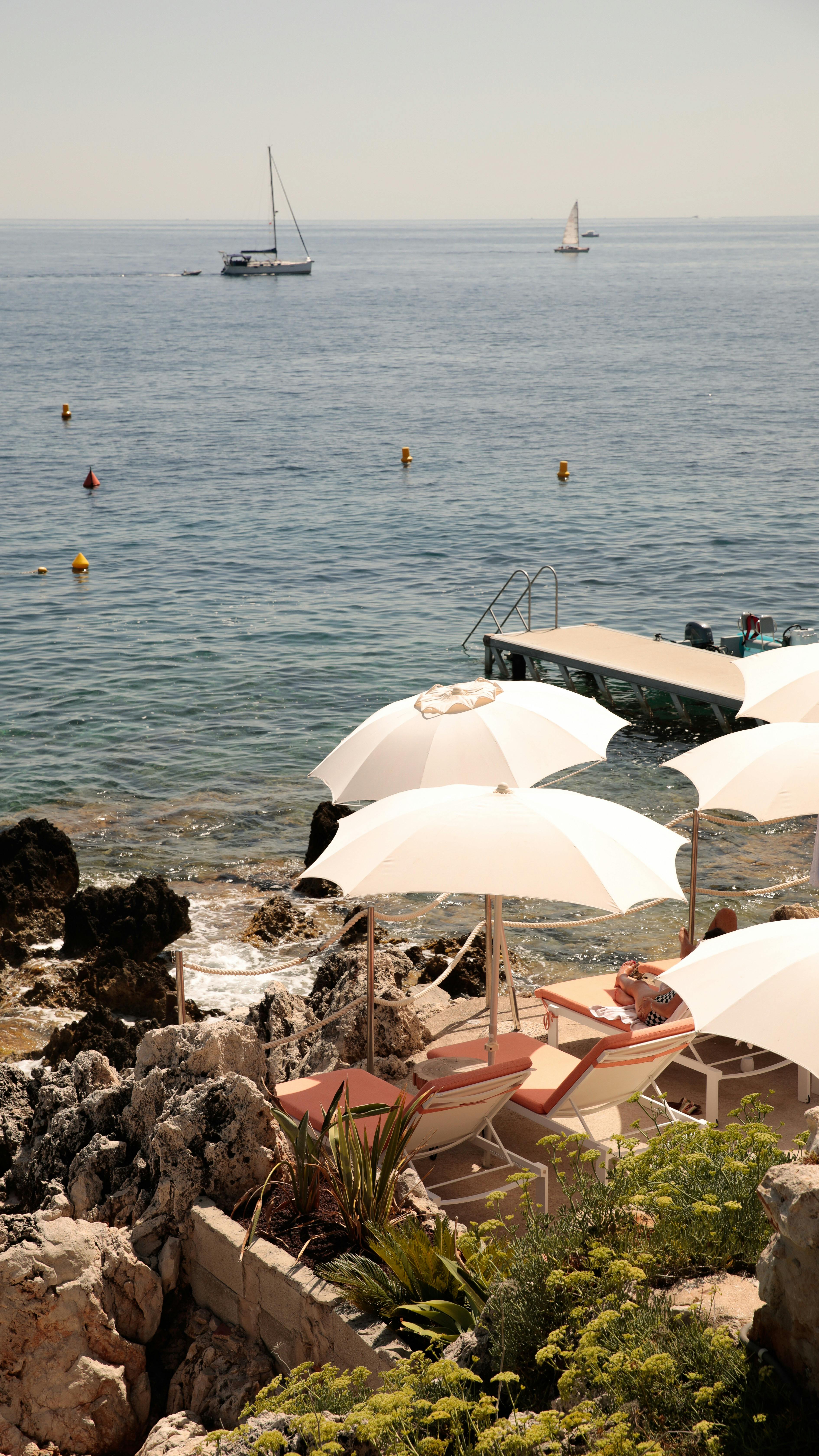 Deckchairs lined up overlooking the sea on the Amalfi Coast
