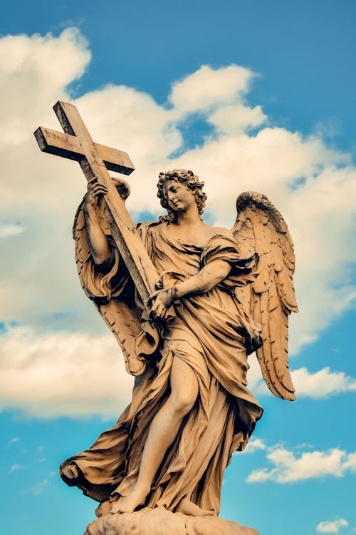 Statue of Angel Holding Cross