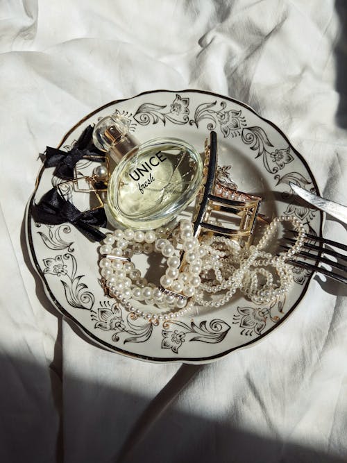 Plate with Jewelry and a Perfume Bottle