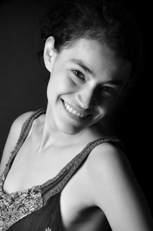 Black and White Portrait of a Smiling Girl