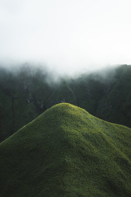 Green Hilltops under Clouds