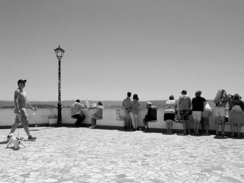 Free Black and white photo of people viewing a scenic horizon from a promenade. Stock Photo