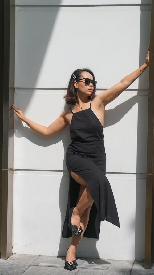 Woman Posing in a Black Dress