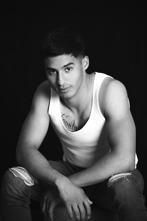 Black and White Studio Shot of a Young Man in a Tank Top 