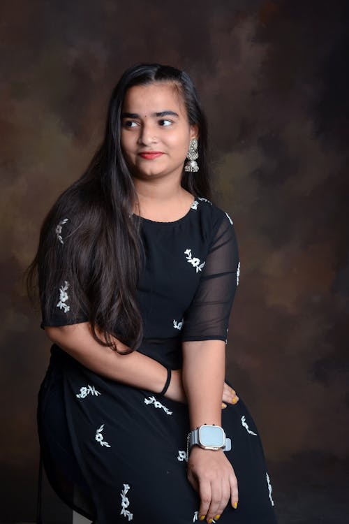 Woman with Black Hair and in Black Dress