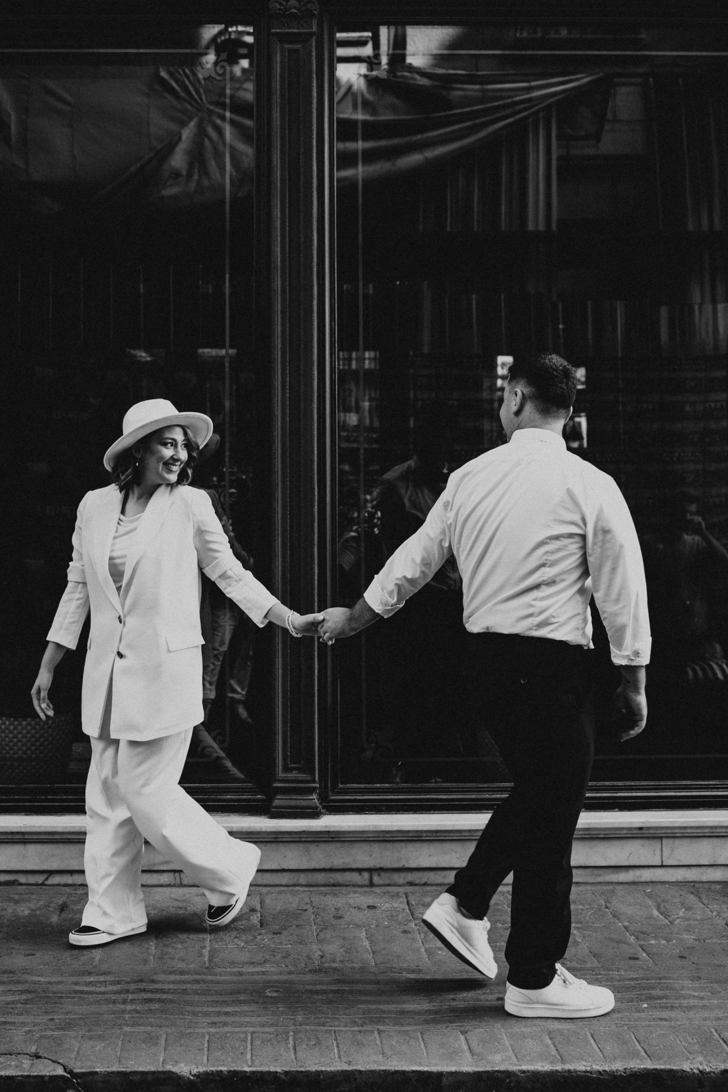 A black and white photo of a couple holding hands · Free Stock Photo