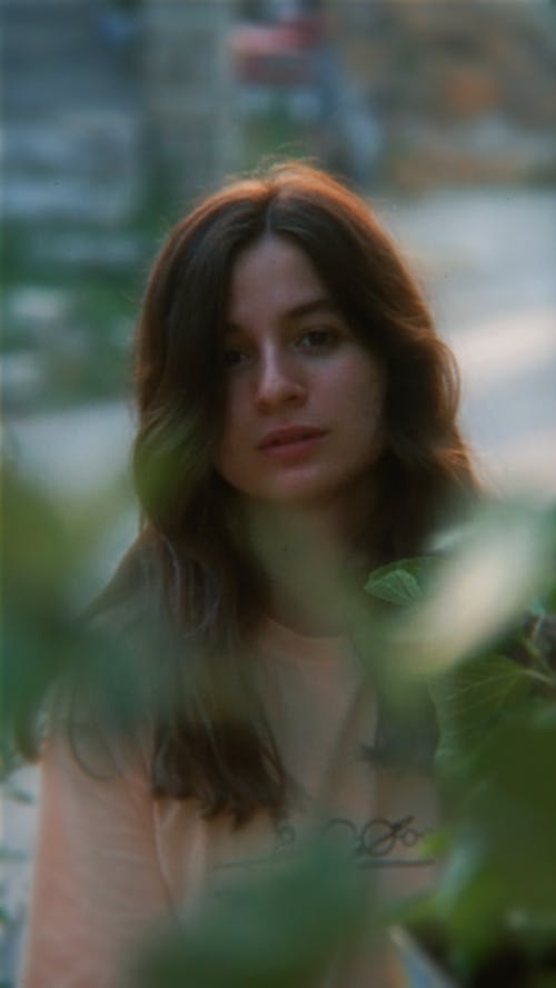 Portrait of Woman behind Leaves