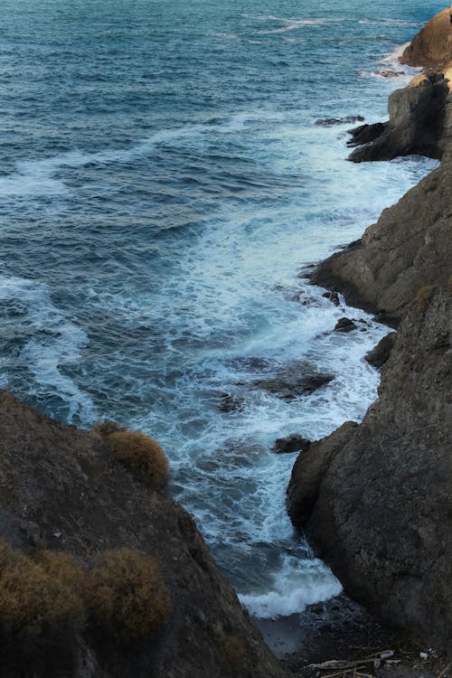 View of Waves Crashing on the Rocky Shore 