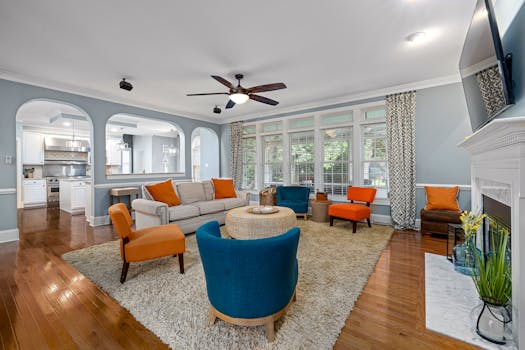 Spacious modern living room featuring colorful furniture and stylish interior design.