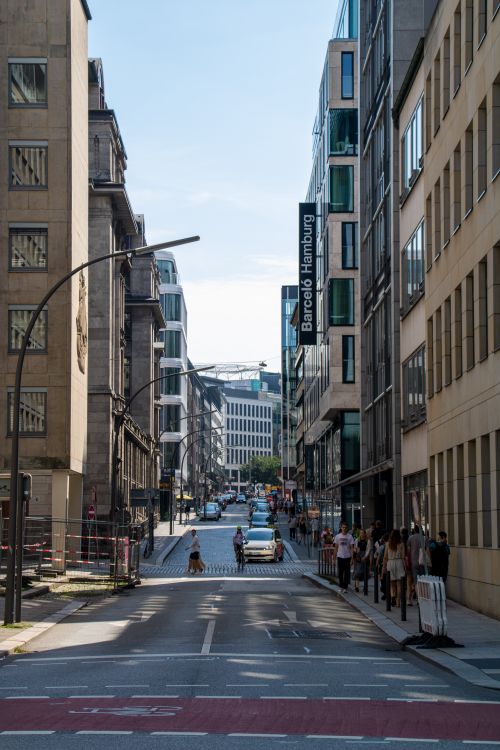 Free View of a bustling street in Hamburg, capturing urban architecture and city life. Stock Photo