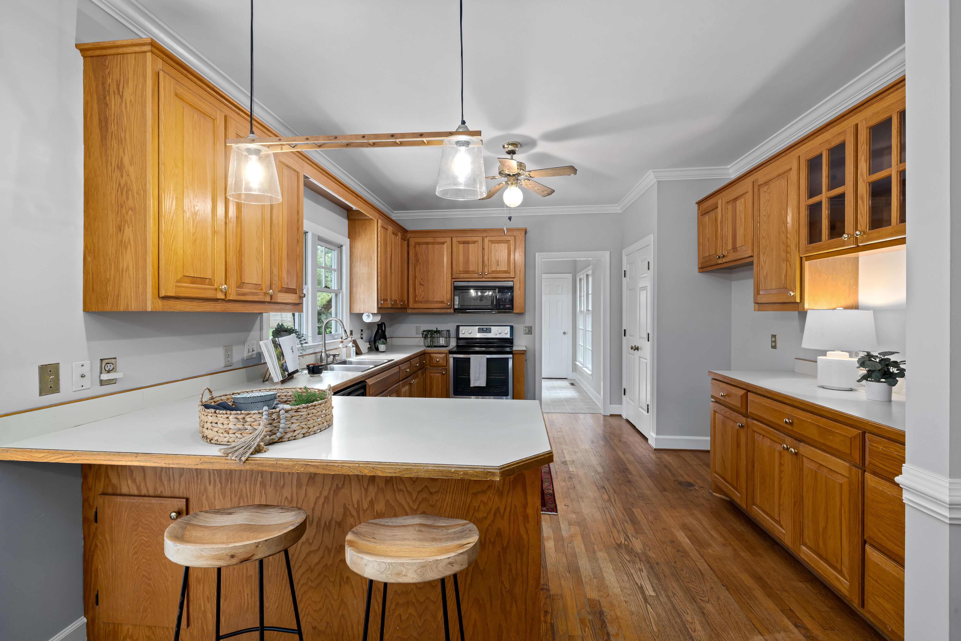 A suburban kitchen with oak cabinets worth refacing
