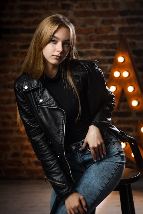 Model Posing in Leather Jacket and Jeans