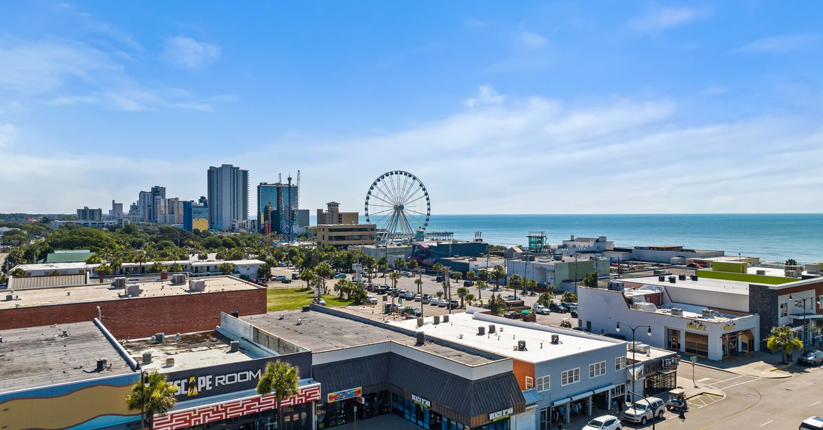 Explore the vibrant cityscape and stunning coastline of Myrtle Beach from above.