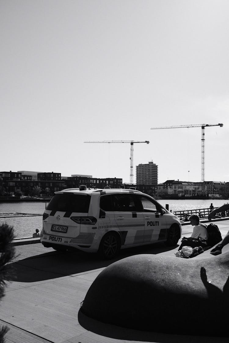 Police Car On Promenade In Black And White