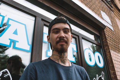 Free Man with Neck Tattoo Stock Photo