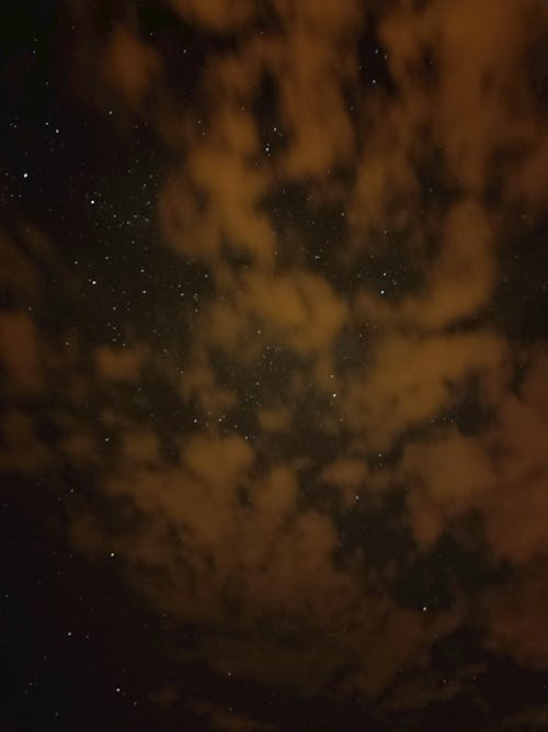 View of a Starry Night Sky and Clouds 