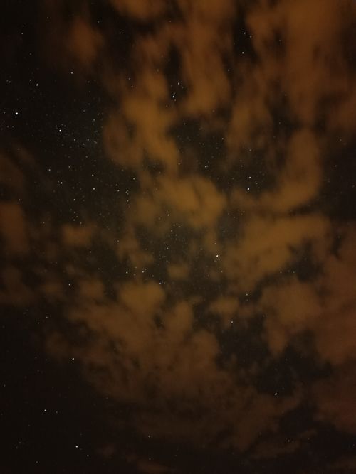 Free A captivating night sky filled with stars and clouds, showcasing the galaxy. Stock Photo