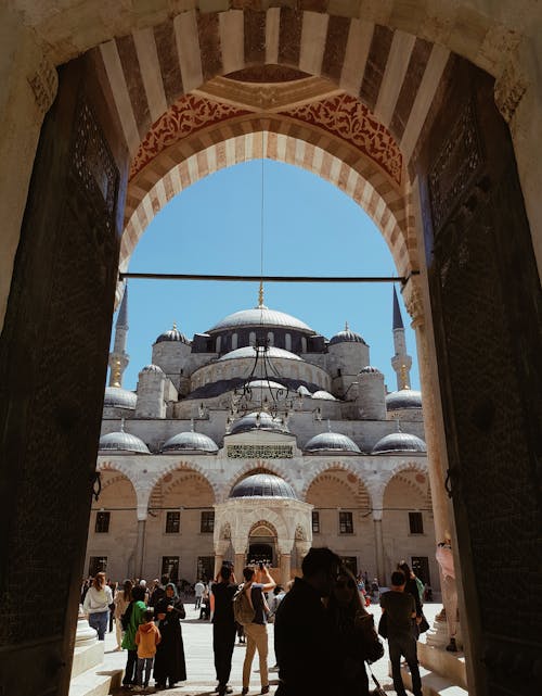Tourists Walking around the Courtyard of the Blue Mosque in Istanbul, Turkey 